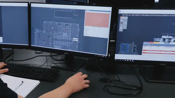 GEMOS PSIM operator workstation with multiple monitors displaying system visualization